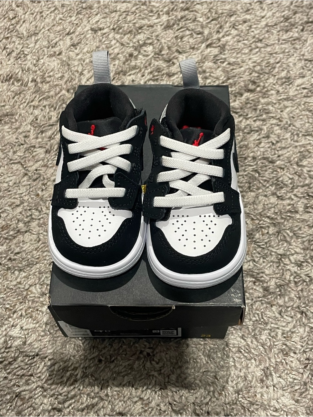 Jordan Black and White Toddler Sneakers with Red Accent